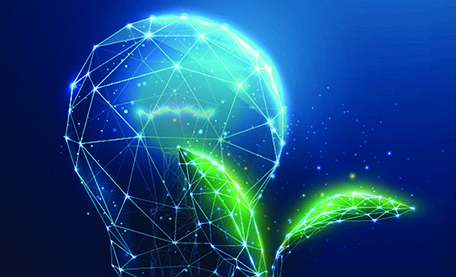 Green plant sprout near blue light bulb